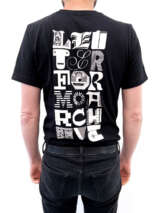 Photo of the back of a person wearing a black t-shirt with the words “LETTERFORM ARCHIVE” in three columns of letters from various sources.