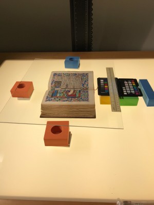 Children’s blocks and foamcore were used to prop up the plexiglass, so this book of hours could be photographed safely.